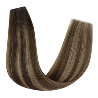 XO Weft Hair Extensions, made from premium 100% human hair bundles, offering luxurious volume and texture, ensuring a natural and elegant enhancement to your hairstyle.
